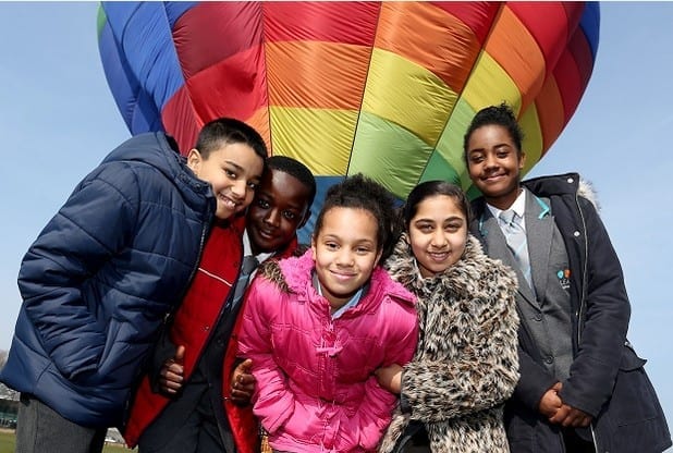 IN PICTURE: (L- R) Pupils from Radford Academy prepare for a hot air balloon ride at The Forest Recreation Ground. Pictured from the left is: Sukharj, Mohammed, Victoria, Simmi and Zannecia.