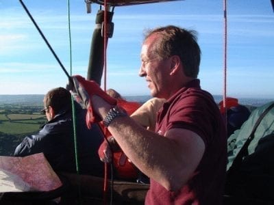 Chief Pilot Clive Bailey expertly navigates the hot air balloon whilst passengers take in the awesome views from the basket.jpg