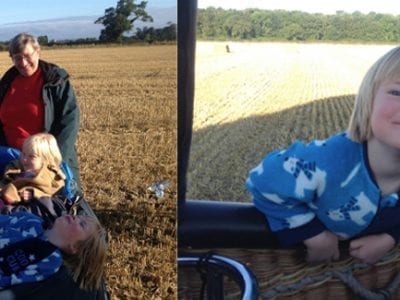 hot air balloon landing in farmers field